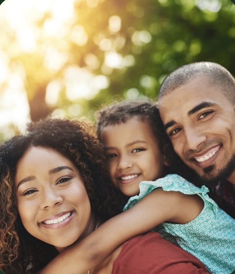 Smiling family selfie outdoors